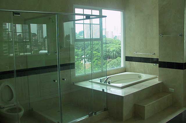 Bathroom Photo Example - luxurious bathroom with sand stone colored tiles and beige bath top