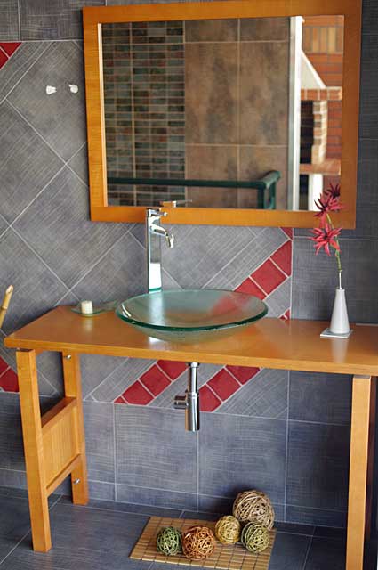 Modern Bathroom Photo Example - Glass Tabletop Setting on Wooden Table