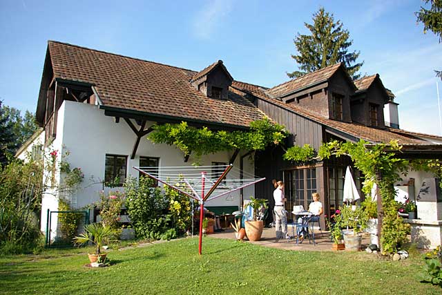 Remodeled country home in Switzerland, what was before an old farm house becomes a family home with a big garden
