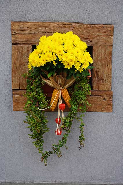 Example decor idea on a traditional old country home with a simple but very effective and beautiful flower decoration in a small window