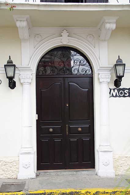 Photo Example of a beautifully old colonial renovated door that maintains its old dark wood finish