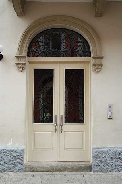 Photo Example of a beautifully old colonial two winged renovated door in a clear beige color