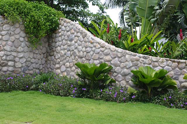  Photo Example of a fence in natural river stone style