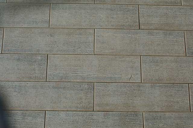 Example of a rustic wood imitation floor tile style, seen this one on a large terrace in a hotel