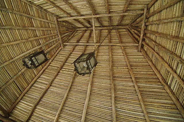 Example roof made of natural wood and covered with palm leaves on a beach hut