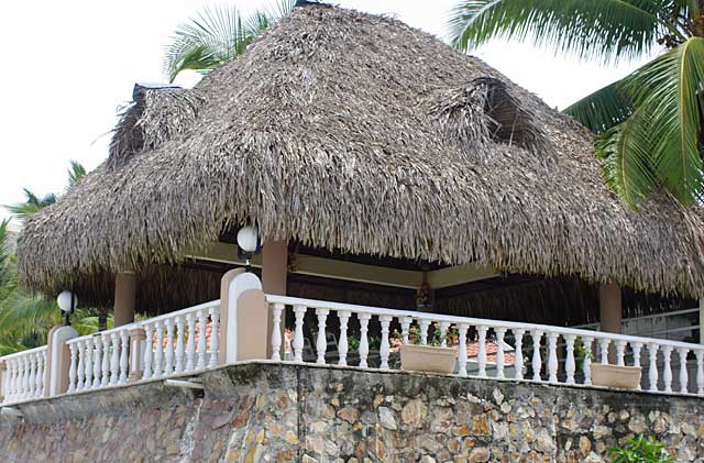Example photo of a roof on a beach hut, this roof is covered with palm leaves