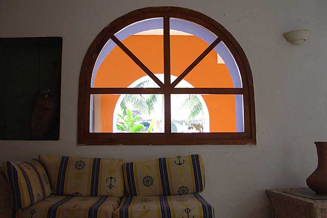 Photo of a simple but great design of a window with great color effects, here seen from the inside of the house