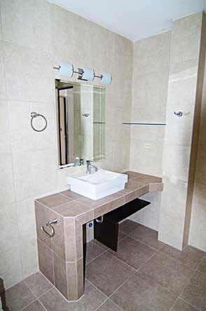 Bathroom vanities with concrete and covered with ceramic tiles
